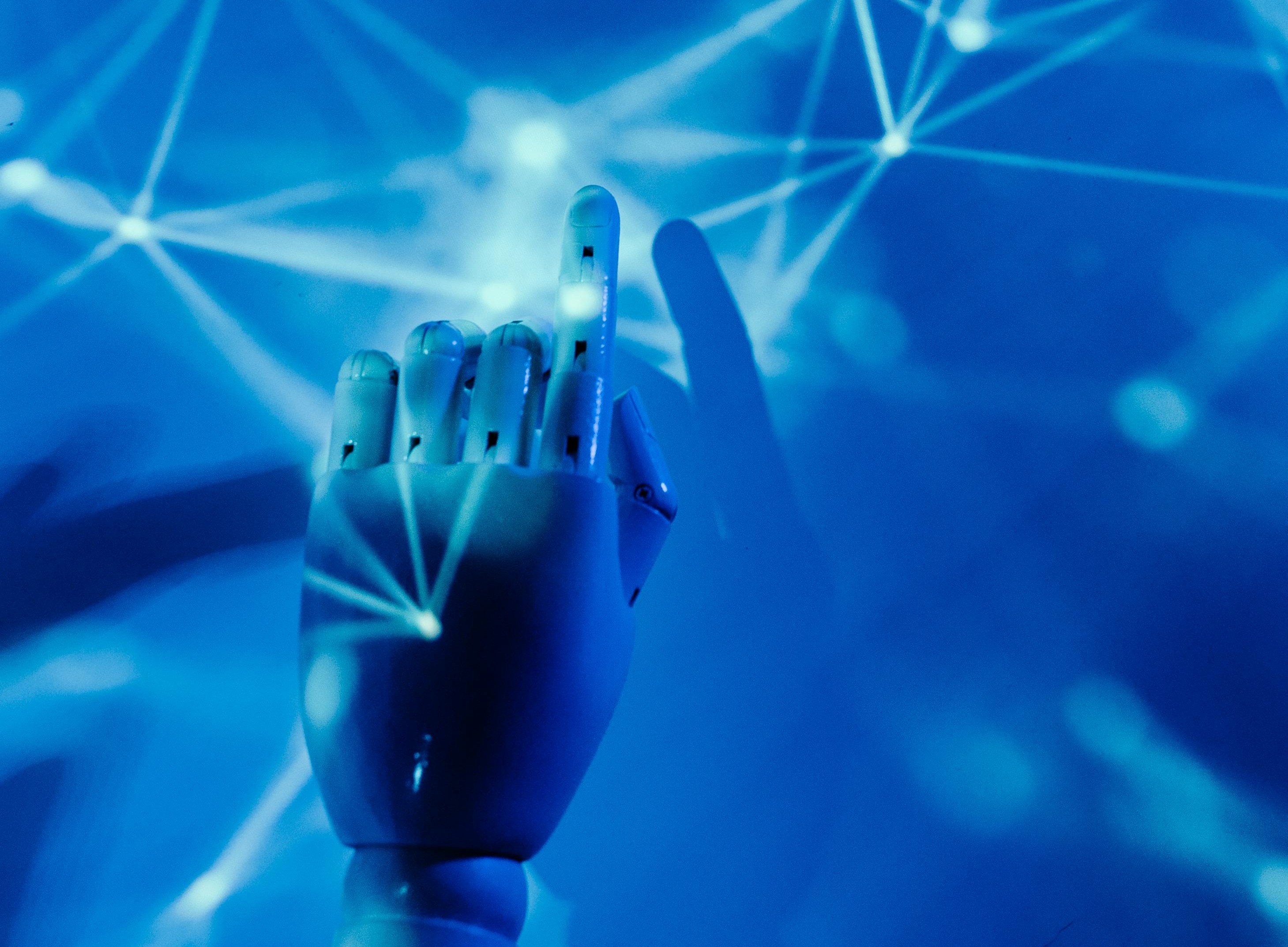 A hand touching blue flickers of electricity