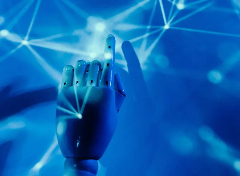 A hand touching blue flickers of electricity The AI-Ready Organisation: From Strategy to Execution