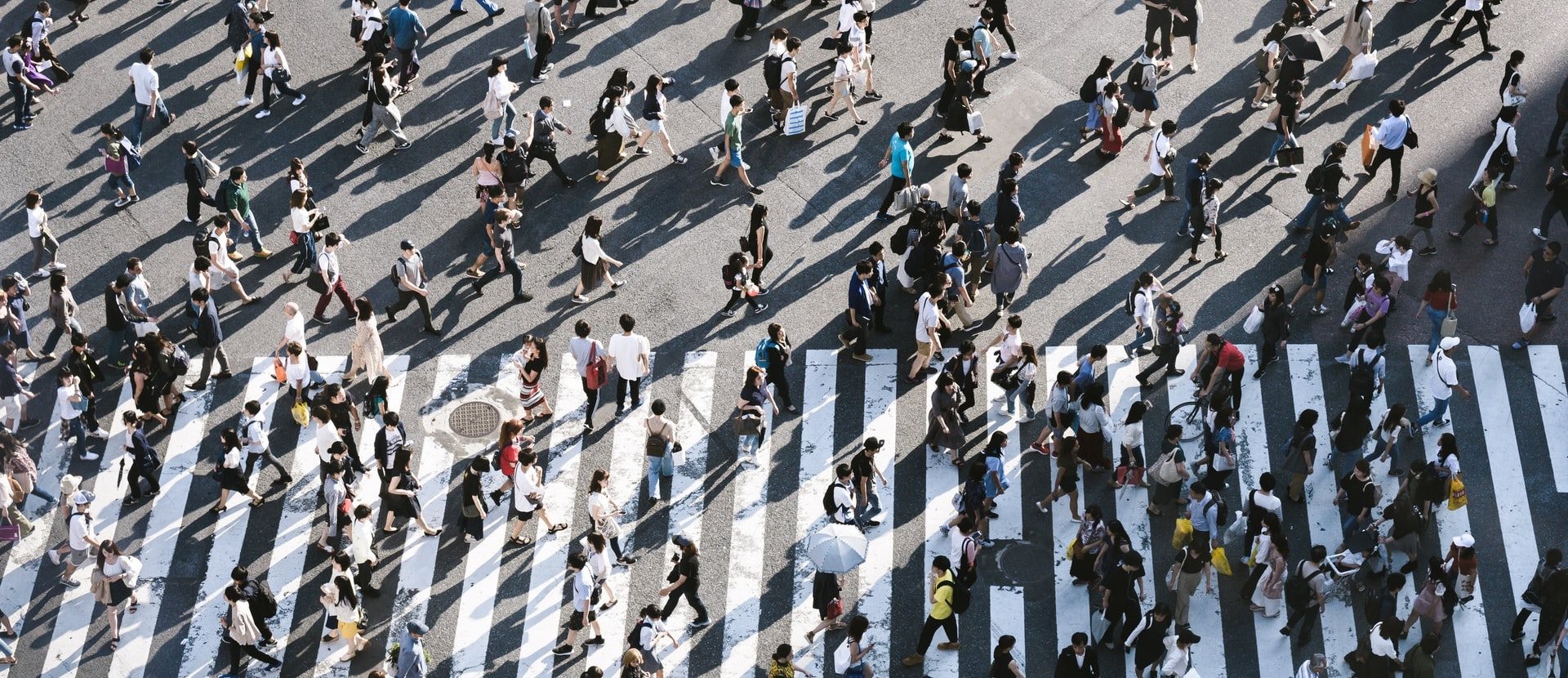 People walking on street Lives vs Livelihoods