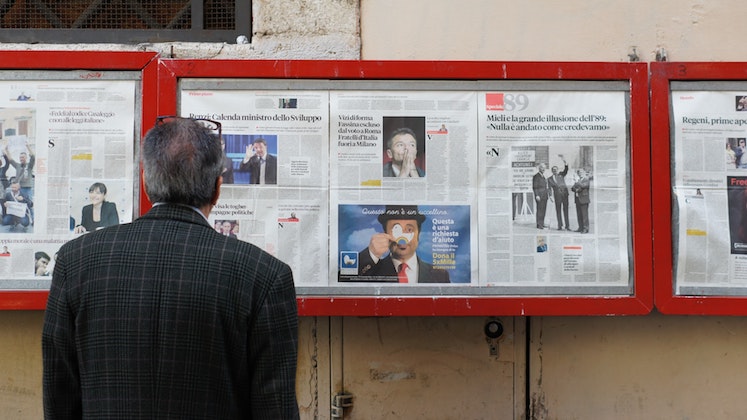 Man reading newspaper