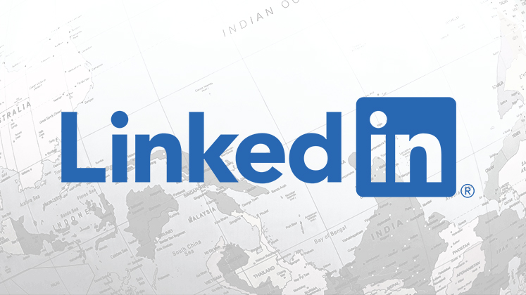 The LinkedIn logo overlaid over the world map.