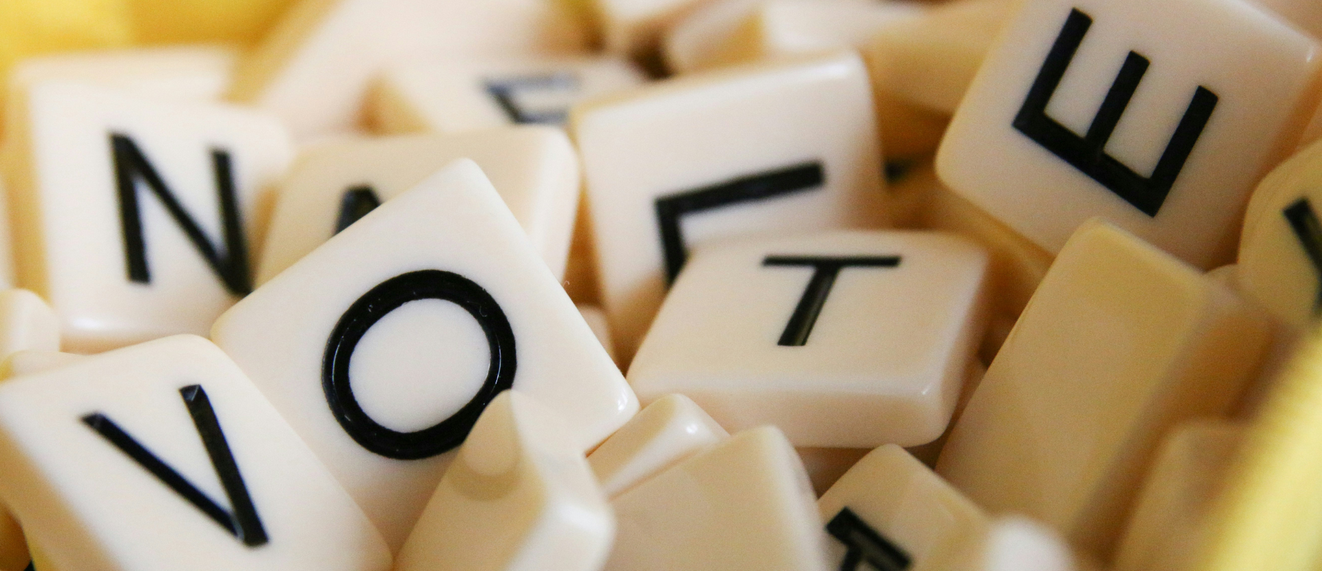 Scrabble pieces spelling out "Vote"
