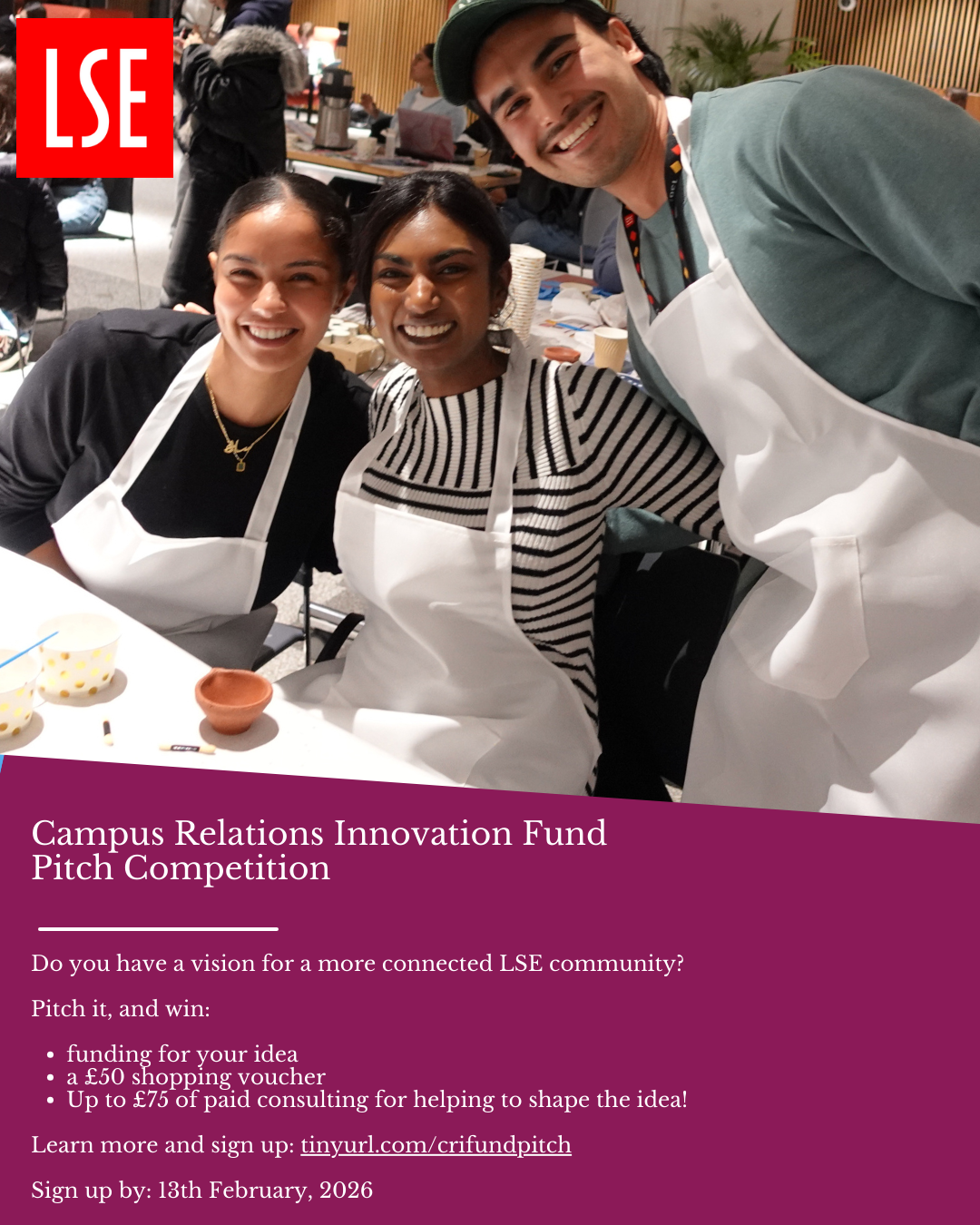 Three students in aprons pose for a photo