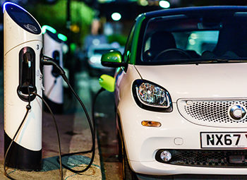 Smart electric car charging in the London Street st night.