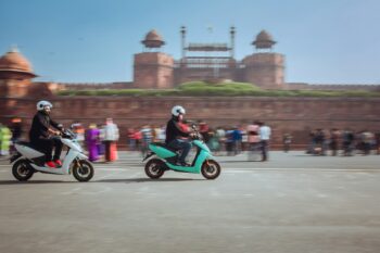 Electric scooters in front of the Red Fort, Delhi