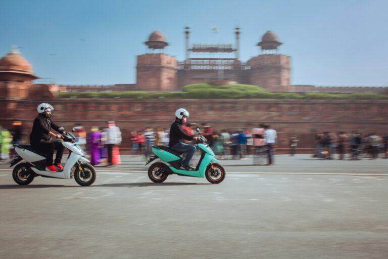 Electric scooters in front of the Red Fort, Delhi