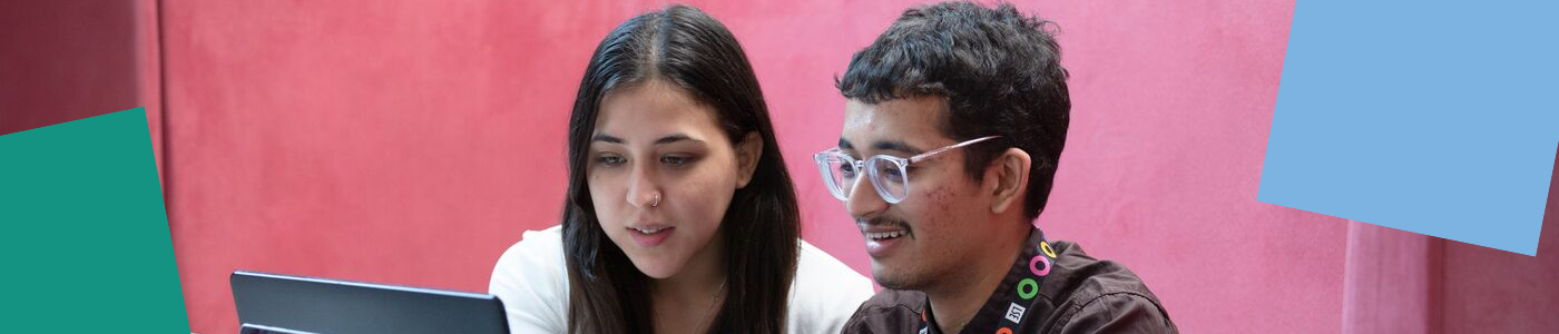 Two students sat at a computer