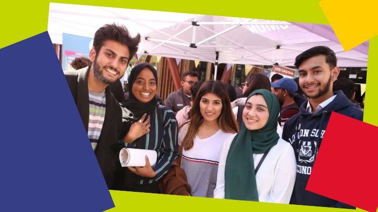 students smiling at camera with lime green surround