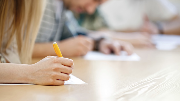 exams-hands-pen-747x420-16-9