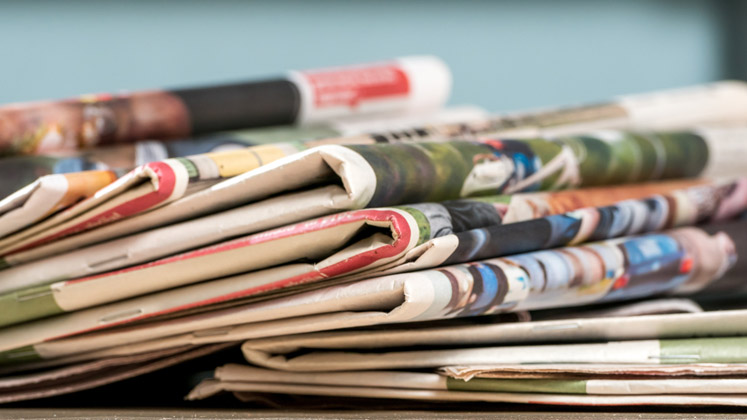 stack-of-newspapers-747x420-16-9