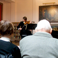 Violinist performing at a Shaw Library lunchtime concert