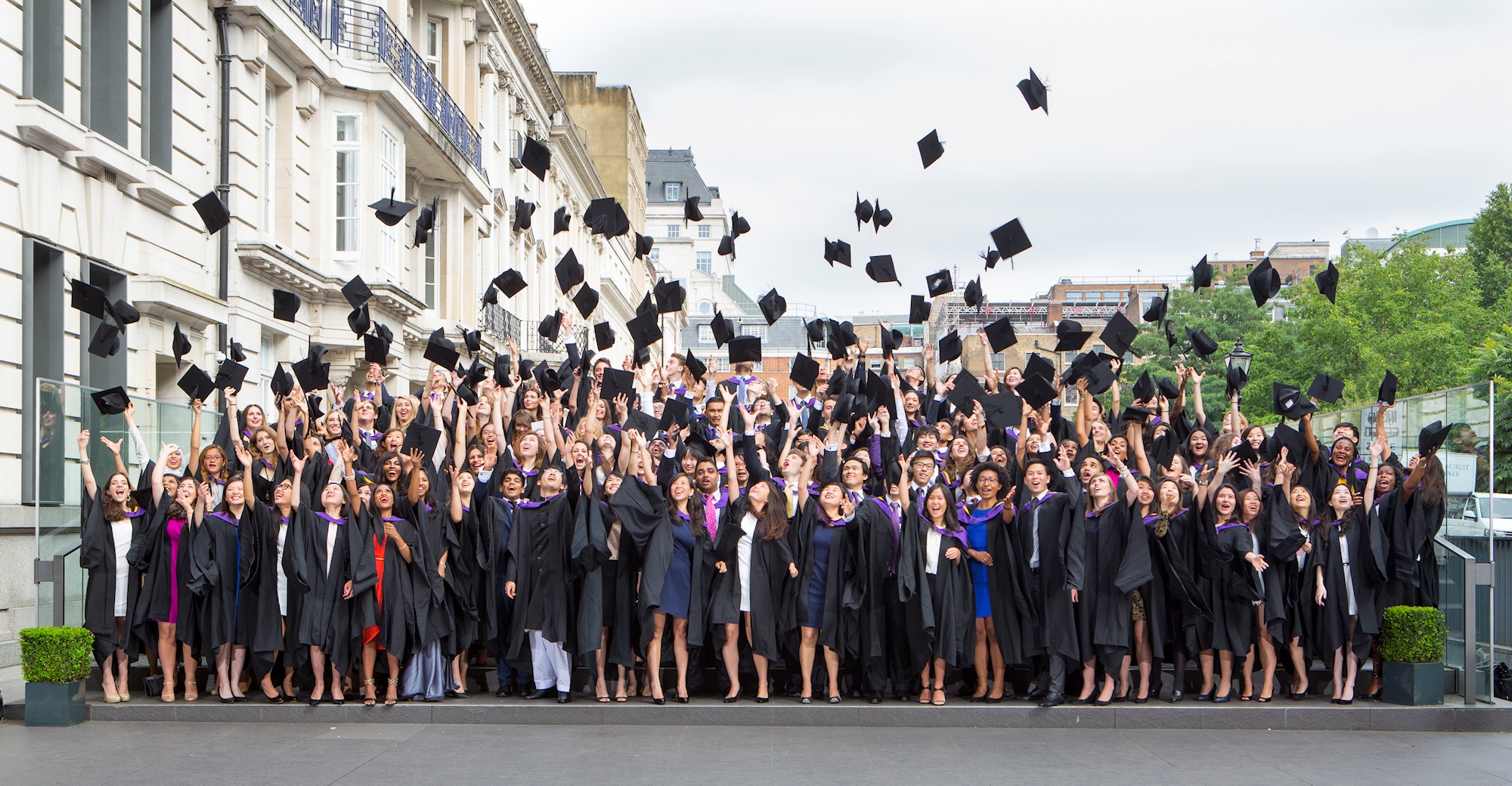 Alumni throwing hats in air