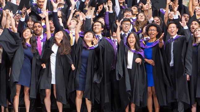 Alumni throwing hats in air