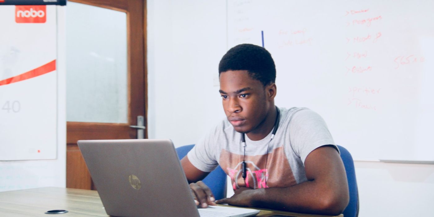 A man working on a laptop.