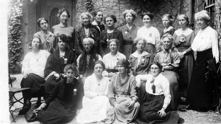 A group photo of about 20 women who were British delegates to a conference.