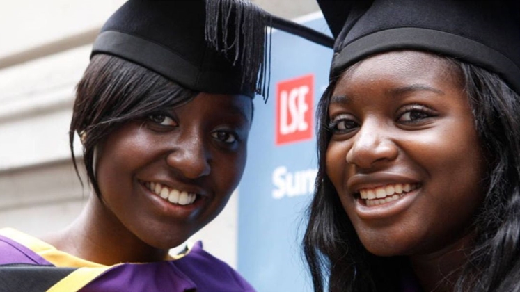 Two smiling LSE students on graduation day