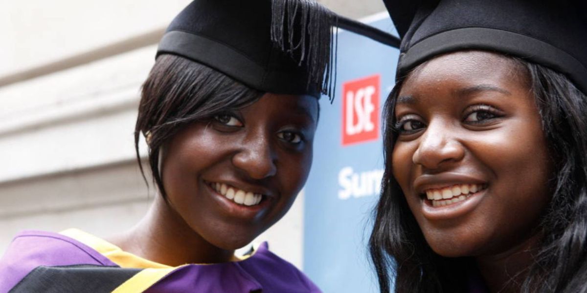 Two smiling LSE students on graduation day