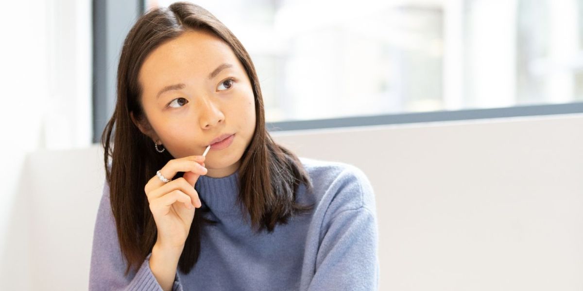 A student looking past the camera with their head slightly turned