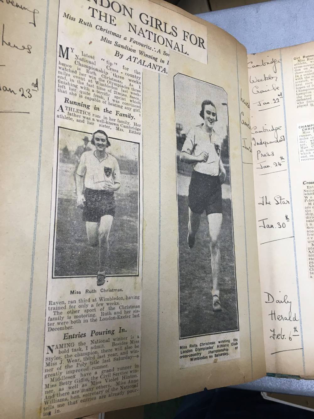 An open page of a scrapbook which includes pictures of an athlete