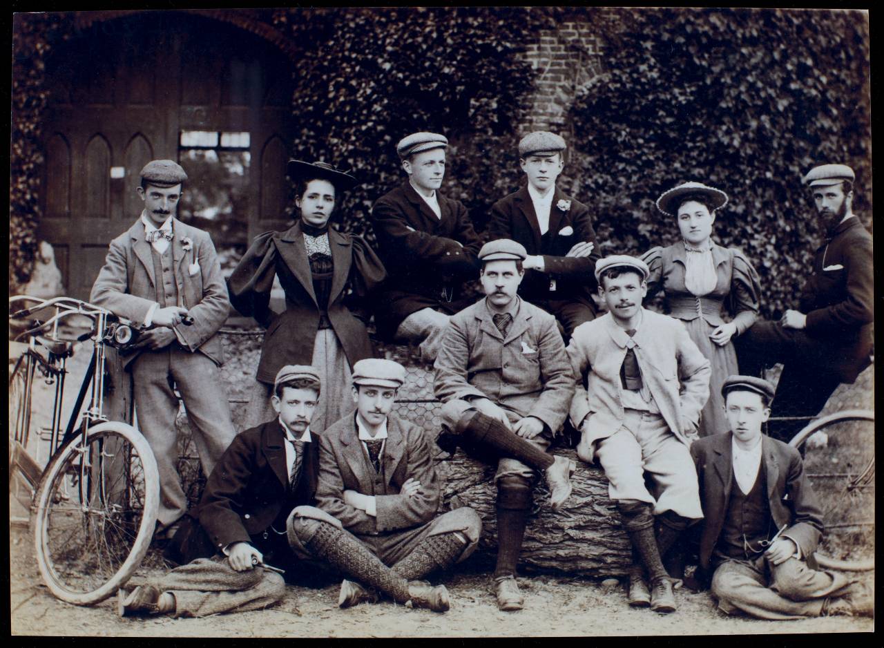 A group photo of smartly dressed cyclists