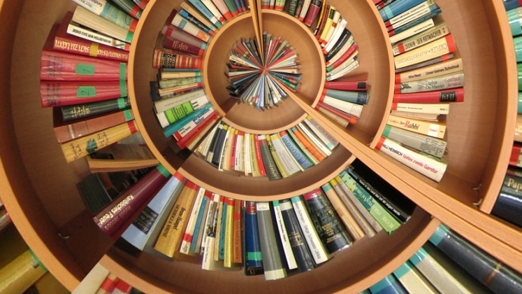 A spiral of books on bookshelves | LSE books blog