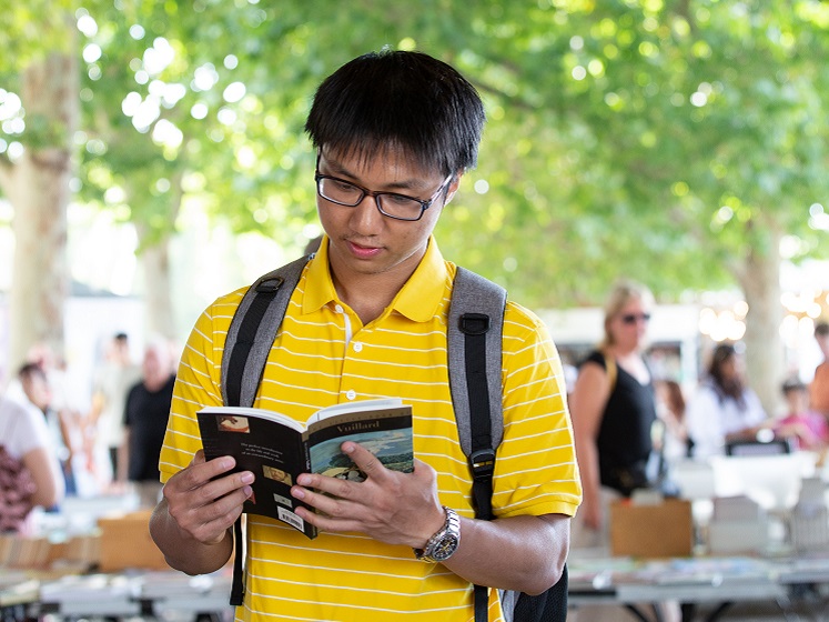 LSE student reading a book summer 2022