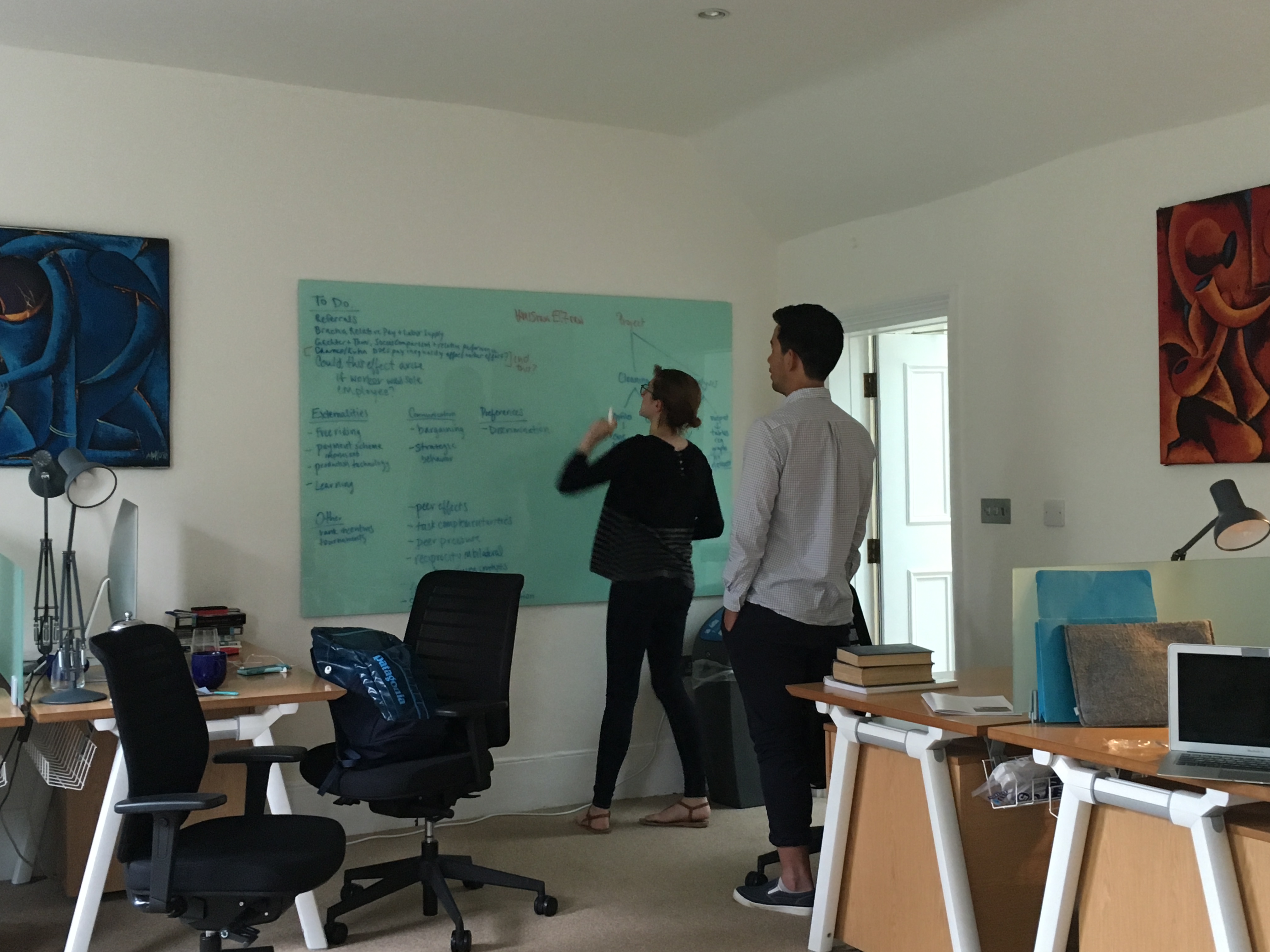 Kim Sarnoff and Shotaro Nakamura at work in the research office