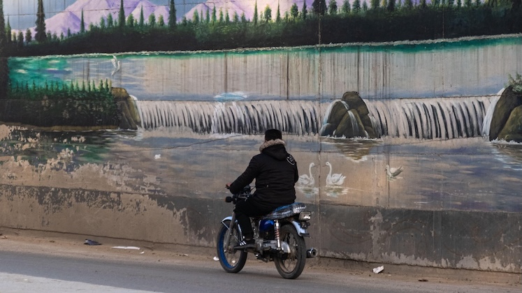 A motorcyclist in Qamishlo, Syrian Kurdistan