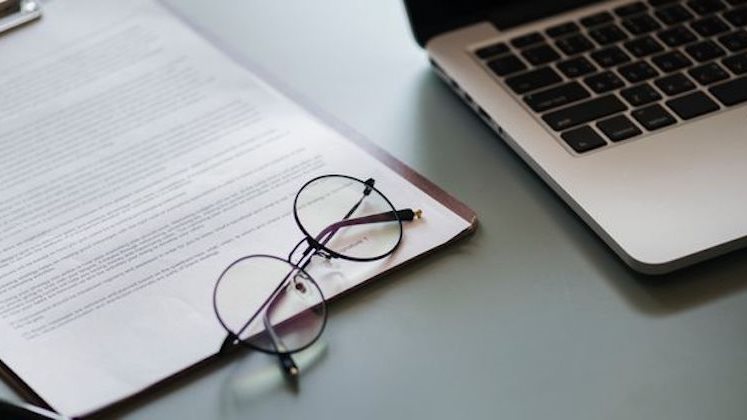 laptop paper glasses