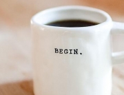 Cup of coffee saying begin