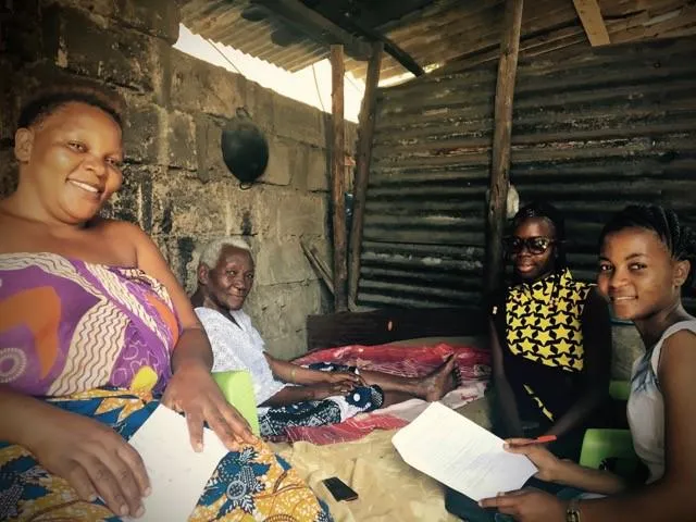 Two trainee enumerators (right) administering a questionnaire