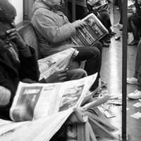 commuters with newspapers 747x420