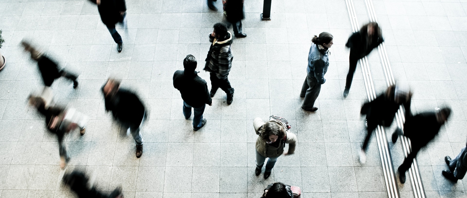 Aerial view of people rushing around a street