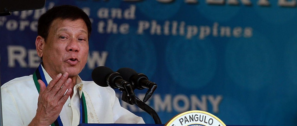 President Duterte of the Philippines speaking into a microphone