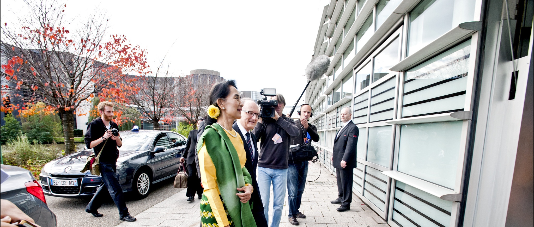 Aung San Suu Kyi being filmed by a camera crew