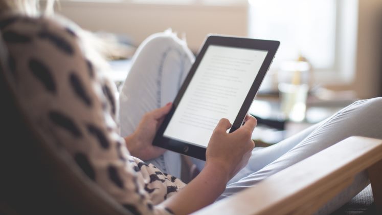 woman at home with ipad