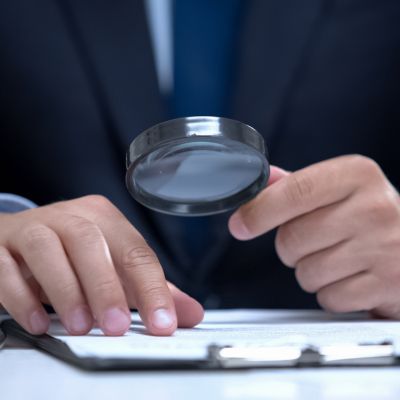 man with magnifying glass research