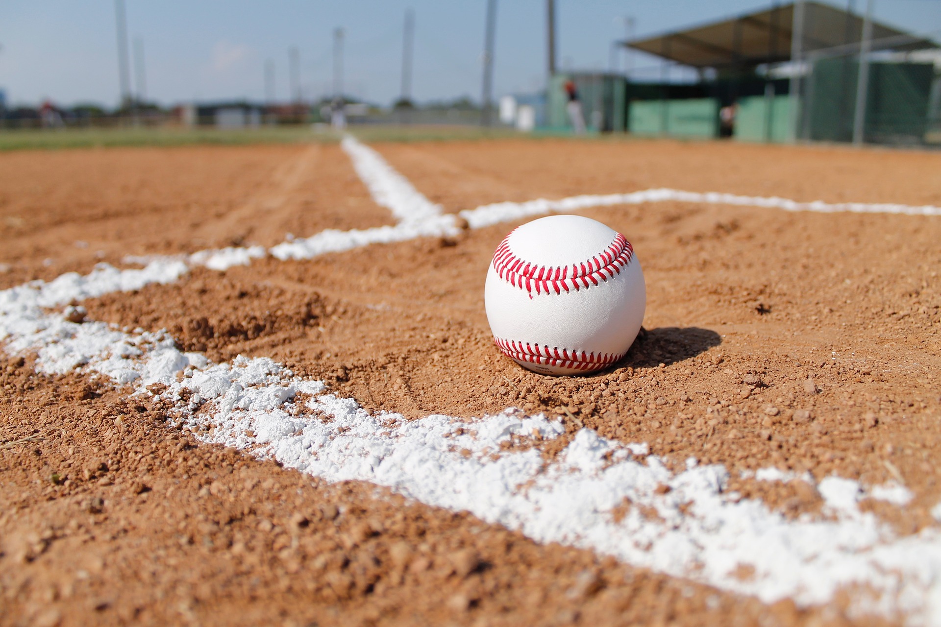 Close up image of a baseball on a baseball field