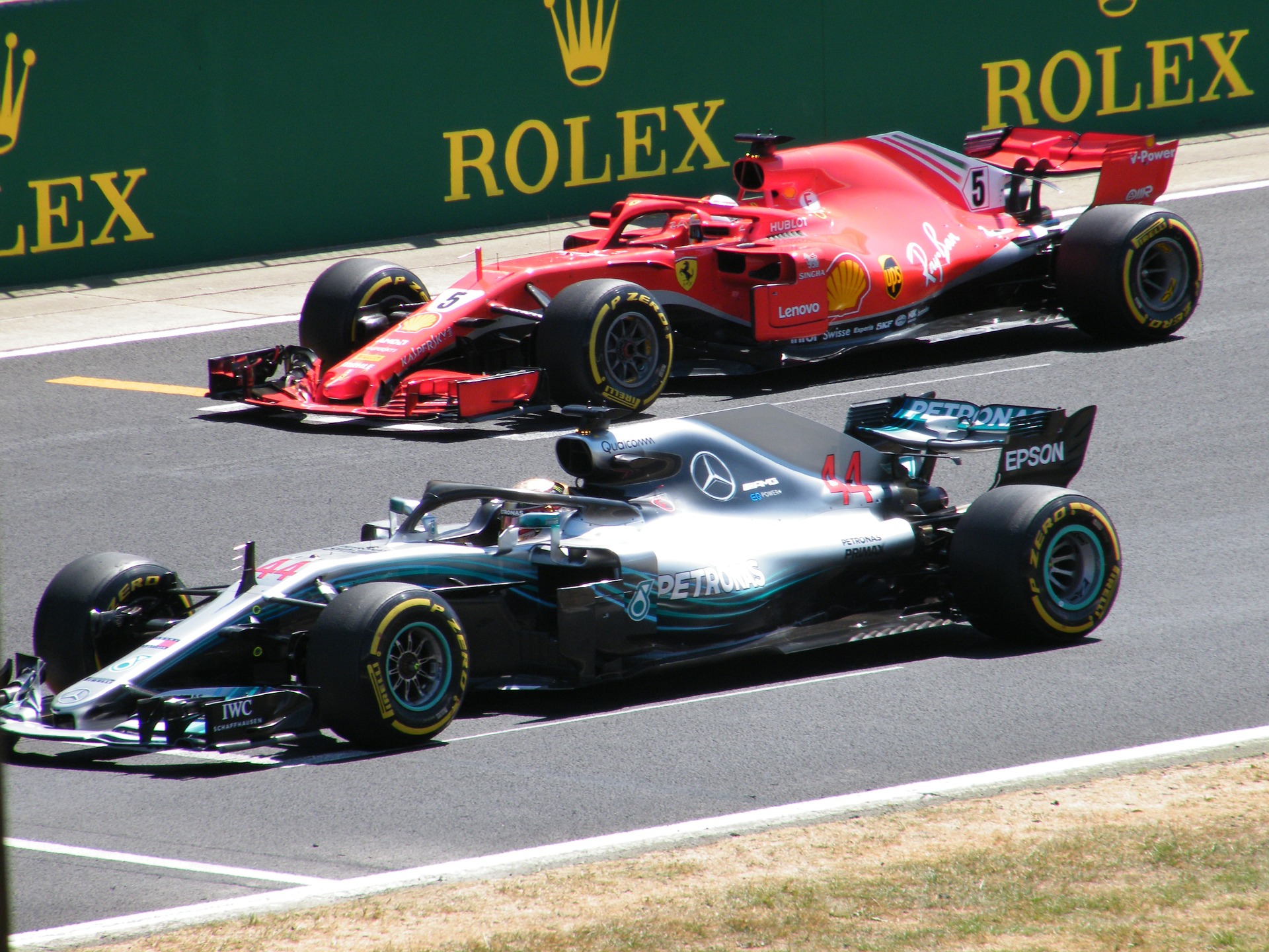Two F1 cars stationary on the grid