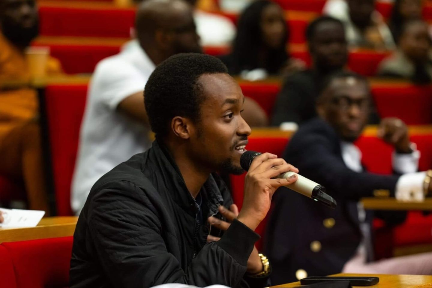 Fred speaking into a microphone during a Spark Professional skills workshop