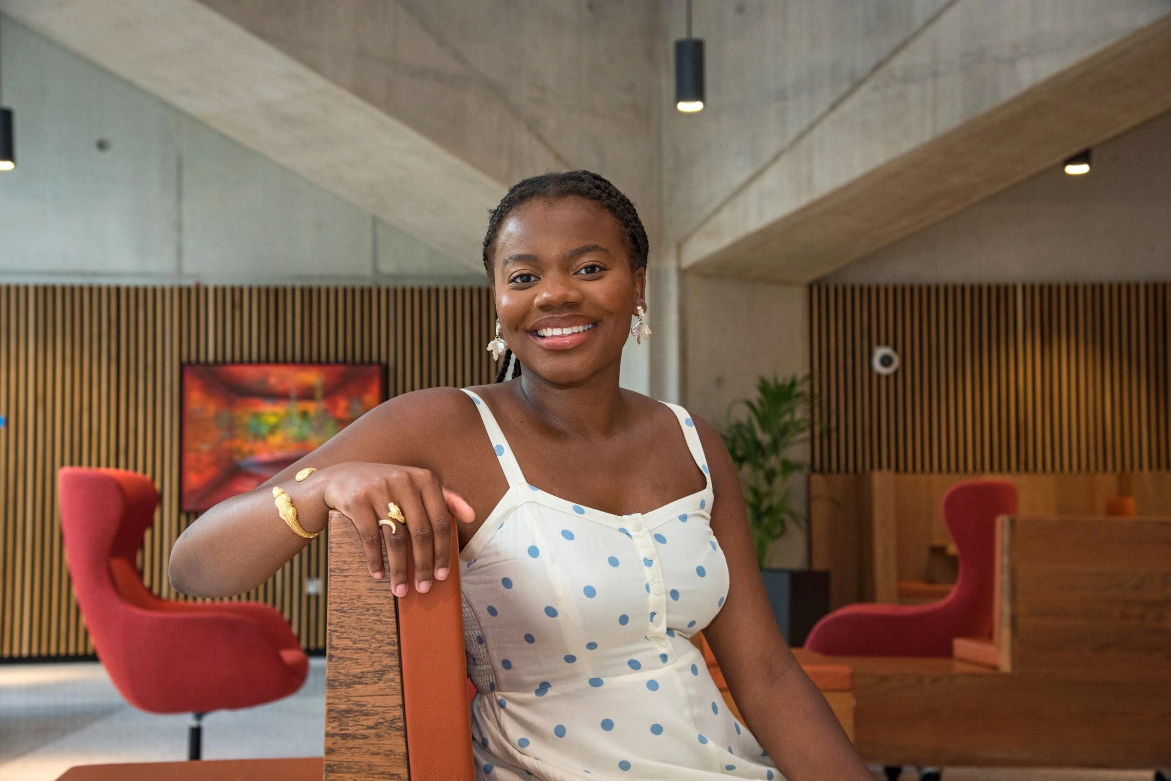 Female student sitting and smiling to camera
