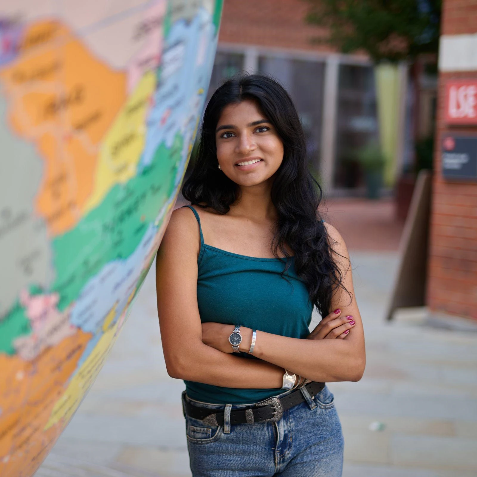 Student next to the globe