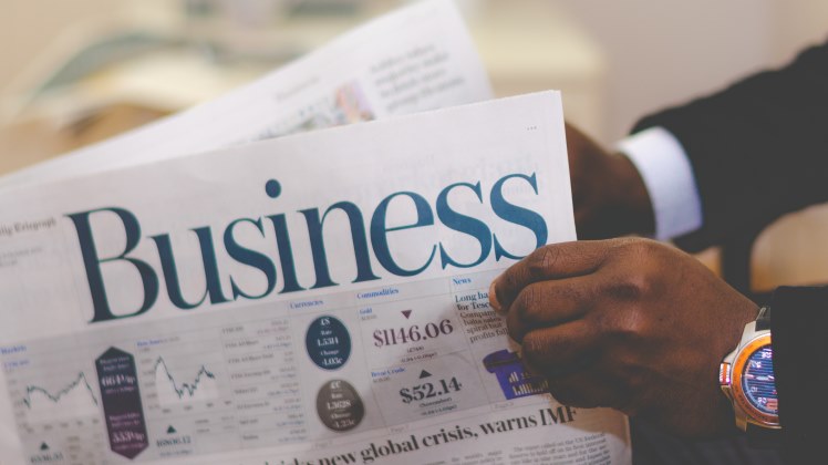 Man holding a newspaper