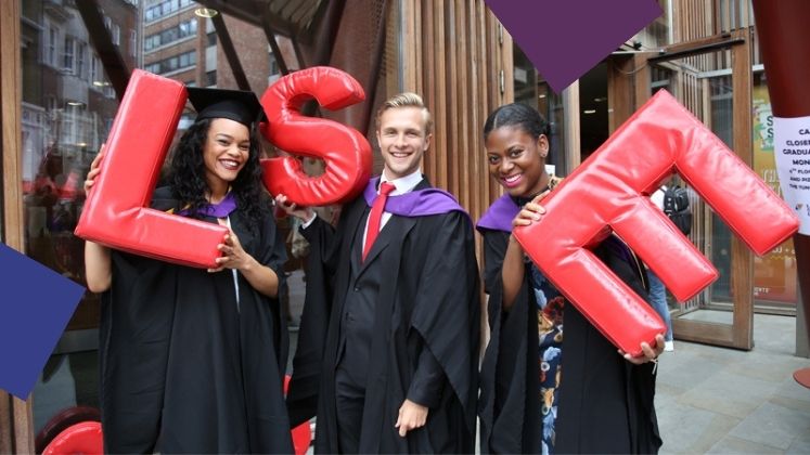 Graduating students hold up letters spelling LSE