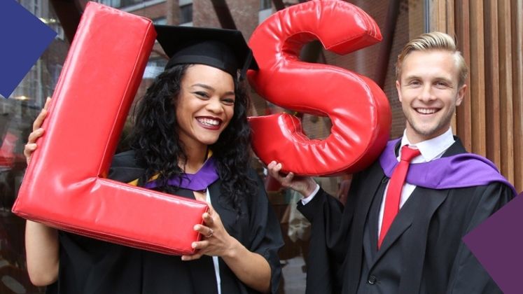 LSE graduates hold foam letters spelling LSE