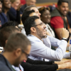 An lecture theatre of smiling people attending a talk. | TRIUM