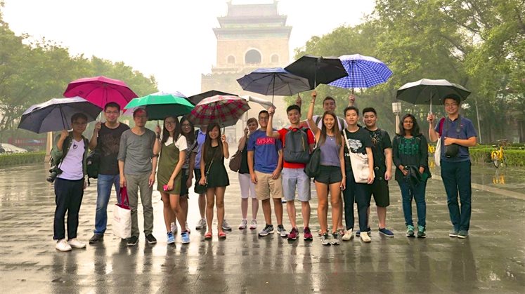 Students in rain 16.9